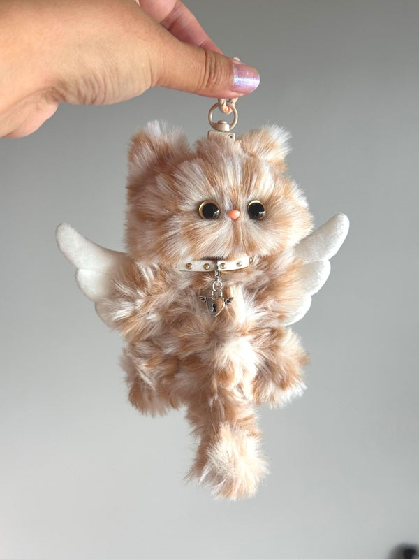 Golden handmade cat charm with white angel wings